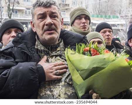 KIEV, UKRAINE - December 6, 2014: Soldier sings national anthem. -- More than 100 soldiers of the battalion of territorial defense \