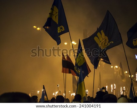KIEV, UKRAINE - January 1, 2015: The torchlight procession in honor of the birthday of Stepan Bandera was held in the city center. It was attended by about four thousand people