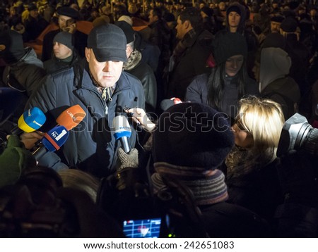 KIEV, UKRAINE - January 1, 2015: LifeNews journalist Zhanna Karpenko (R) interviews leader of Ukrainian Nationalists Oleg Tyagnibok.
