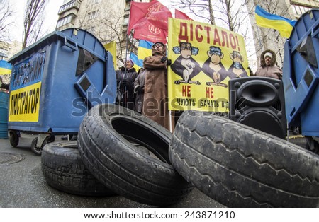 KIEV, UKRAINE - January 13, 2015: Car tires and garbage cans are symbols of lustration near office of the Prosecutor General of Ukraine