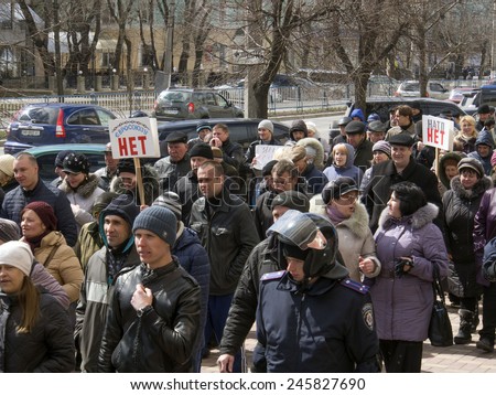 LUGANSK, UKRAINE - April 5, 2014: Pro-Russian activists followed by the Ukrainian police are moving towards the building of the Security Service of Ukraine in Lugansk.
