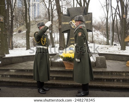 KIEV, UKRAINE - January 29, 2015: Soldiers guard of honor lay flowers at the monument. President Poroshenko attended ceremony Kruty Heroes