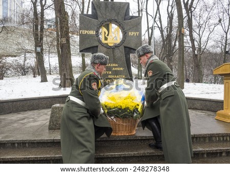 KIEV, UKRAINE - January 29, 2015: Soldiers guard of honor lay flowers at the monument. President Poroshenko attended ceremony Kruty Heroes
