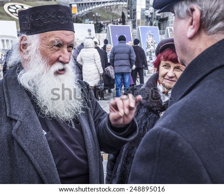 KIEV, UKRAINE - February 1, 2015: The priest discusses with passers current political situation in the country. Independence Square
