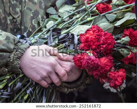 KIEV, UKRAINE - February 12, 2015: Ukrainians attend the funeral ceremony for servicemen of \