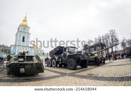 Padded Russian military equipment against the backdrop of St. Michael Monastery,  documentary exhibition \