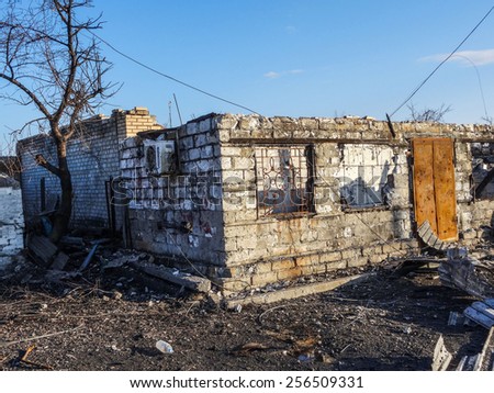 NIKISINO, UKRAINE - Feb 27, 2015: Ruined house. Village Nikishino located 20 km from Debaltseve, Ukrainian military was abandoned three days ago. Separatist forces attacked it for several days.