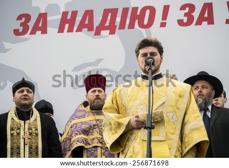 KIEV, UKRAINE - MARCH1, 2015: Orthodox priest at the time of prayer for Nadia Savchenko -- Activists demand the release of Ukrainian government forces pilot Nadiya Savchenko from Russian prison.