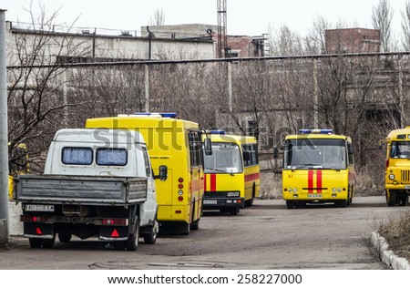 DONETSK, UKRAINE - March 4, 2015: Vehicles of rescue personnel near  following an explosion in the separatist-held eastern Ukrainian area of Donetsk.