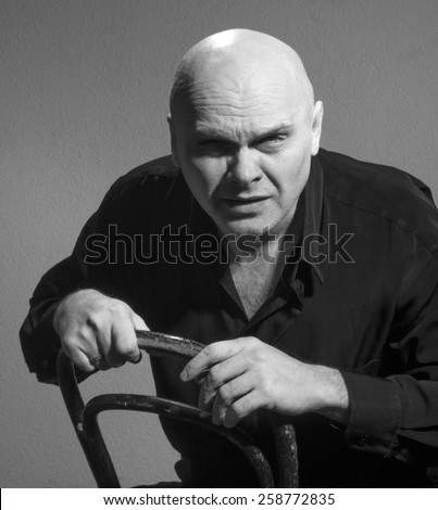 Studio black and white portrait caucasian bald men. Emotions. suspicious