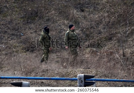LISICHANSK, UKRAINE - March 12, 2015: Sappers inspect railway near the road bridge. Task Force Security Service of Ukraine together with the police prevented a terrorist act