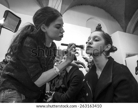 KIEV, UKRAINE - MARCH 18, 2015: A model has her makeup done backstage during Ukrainian Fashion Week