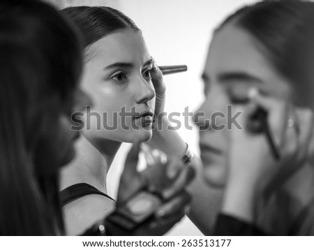 KIEV, UKRAINE - MARCH 18, 2015: A model has her makeup done backstage during Ukrainian Fashion Week