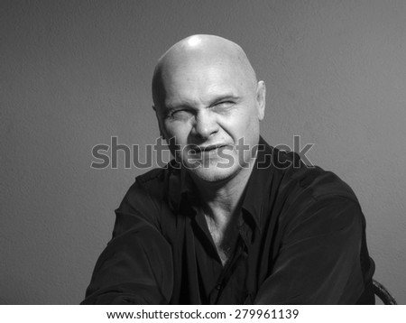 Studio black and white portrait caucasian bald men. Emotions. contempt