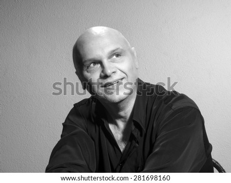 Studio portrait of caucasian bald men. Emotions. Dreamy