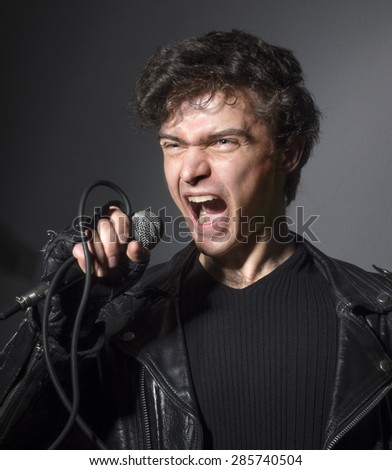 Rock singer screaming on the microphone