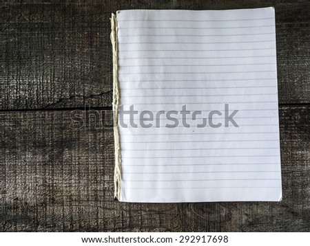 Vintage exercise book on wooden background