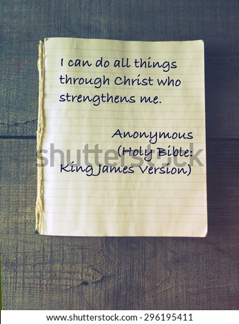 I can do all things through Christ who strengthens me. Holy Bible. Vintage exercise book on wooden background