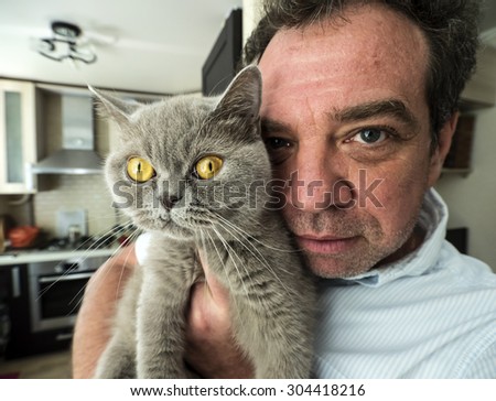 man with his cat