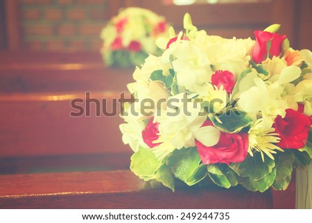 Beautiful flowers wedding decoration in church, process in vintage style.