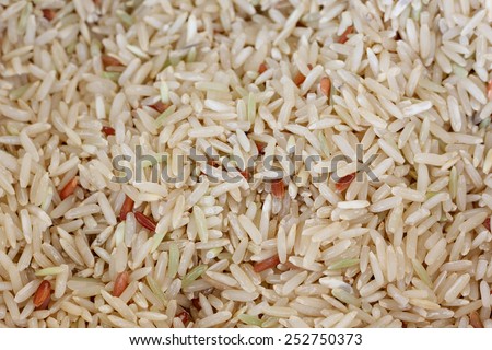 coarse rice or half polished rice background, uncooked raw cereals, macro closeup