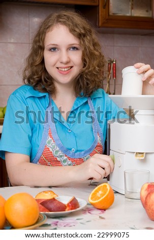 Girl with blender and fruits on home kitchen