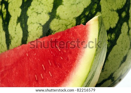 Beautiful delicious water melon. Slice in front of whole melon.