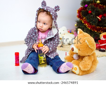 Portrait of little girl with teddy bear at home, home comfort and leisure