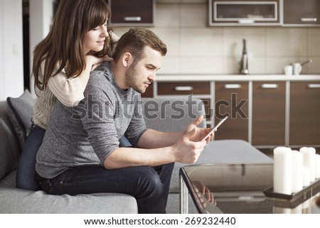 Young couple having fun with surfing the net