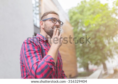 Close up of a man smoking weed