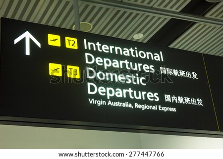 Melbourne, Australia - May 8, 2015: International Departures sign in Melbourne Airport, Melbourne, Australia in the daytime.