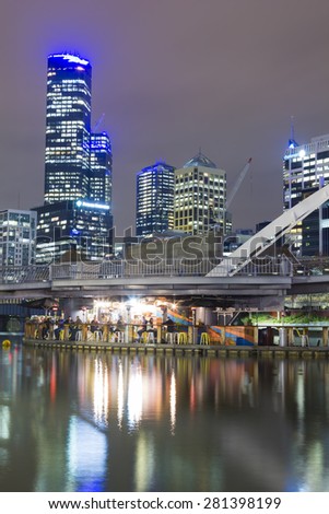 Melbourne, Australia - May 11, 2015: Cityscape of Melbourne, Australia with a restaurant bar at night.