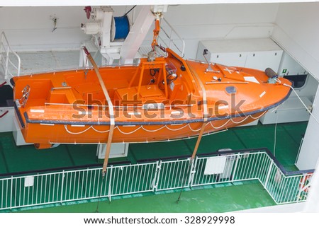 View of modern safety lifeboat carried by a cruise ship for use in emergency evacuation