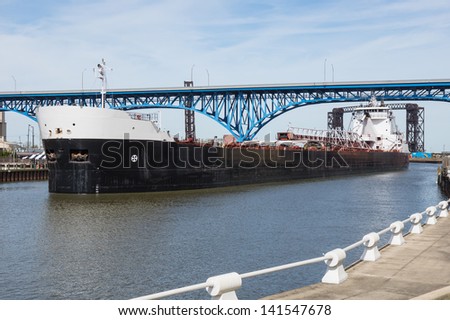 Upbound On The Cuyahoga:  A Great Lakes bulk carrier moves slowly upbound on the Cuyahoga River at Cleveland, Ohio