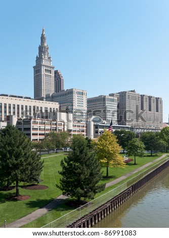 A major Cleveland, Ohio corporation\'s well manicured employee recreation area on the bank of the Cuyahoga River with the Terminal Tower and a portion of the Tower City complex in the background