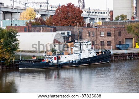 Tug For Sale:  A tugboat that was once part of the US Coast Guard fleet sits moored along the bank of the Cuyahoga River, it\'s current private owners offering it for sale