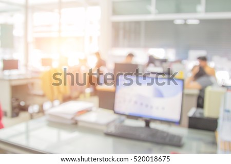 Businessmen blur in the workplace.Table Top And Blur Office of Background.abstract blurred background table work in room with computer. shallow depth of focus.