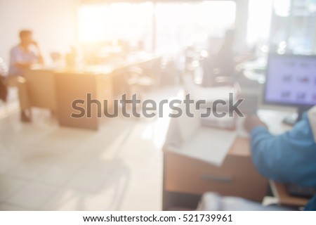 Businessmen blur in the workplace.Table Top And Blur Office of Background.abstract blur background table work in office with computer.Abstract background of office, shallow depth of focus.
