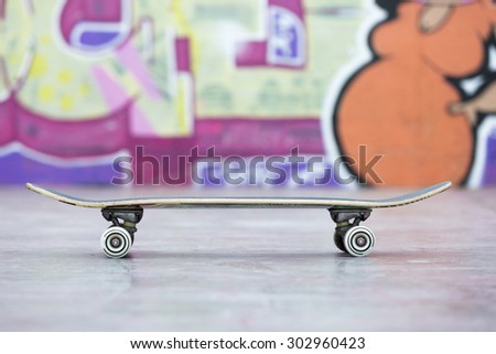 profile view of a skateboard at the skate park - focus on the skateboard