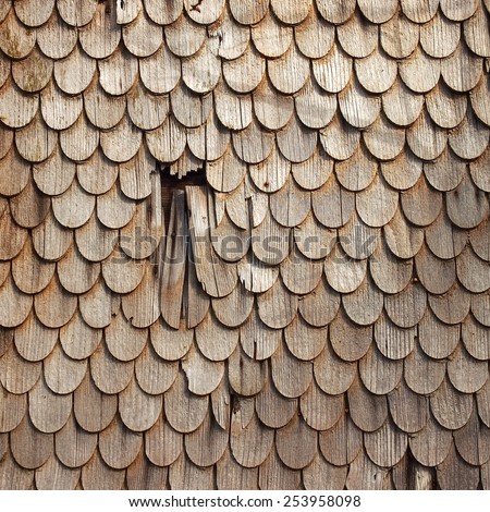 Injured facade of wood shingles