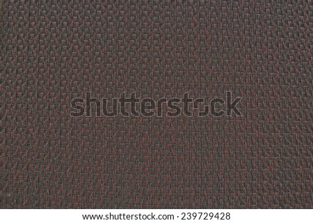 Red woven vinyl with dark lines. The background texture.
