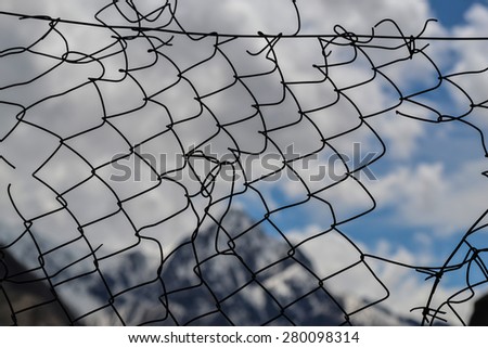 Torn metal mesh. Background