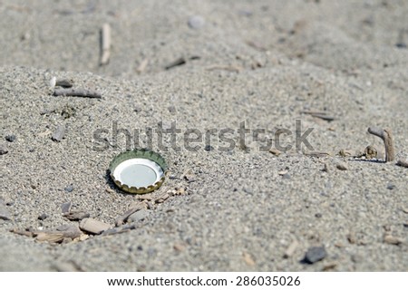 bottle cap on the beach
