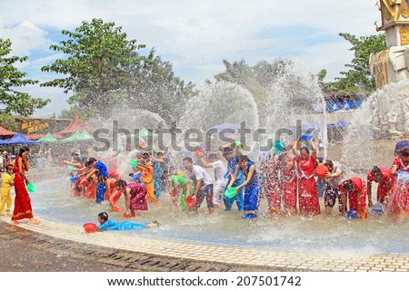 XISHUANGBANNA,CHINA - AUGUST 07,2012 The New Year Water-Splashing Festival, it is also known as the Festival for Bathing the Buddha. It is similar to Thailand\'s Songkran at Xishuangbanna,China