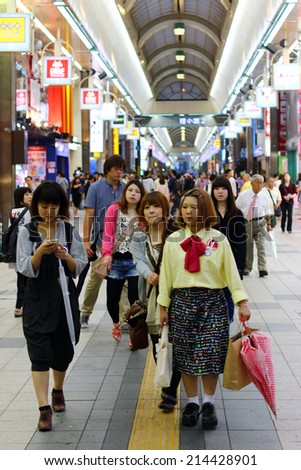 SAPPORO, JAPAN - JULY 10, 2014 : Tanuki Koji is long outdoor shopping arcade with everything ranging from clothing, jewelry and souvenirs to nightclubs, cafes and restaurants in Sapporo, Japan