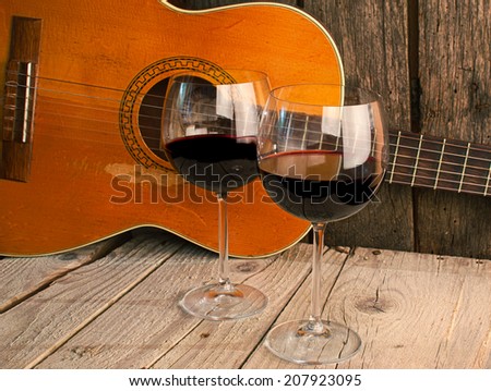 guitar and Wine on a wooden table romantic dinner background