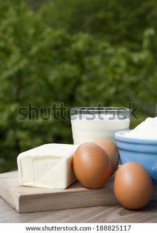 Cake ingredients including milk eggs butter and flour.