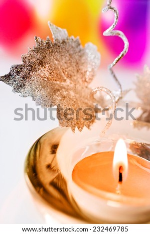 Christmas decoration - candle with flame and silver leaf