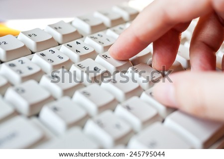 hand writing on the white keybord - computer user