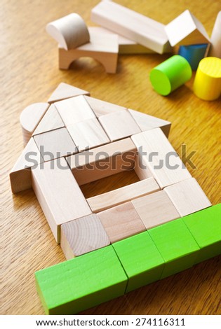 house made of wooden cubes on the table